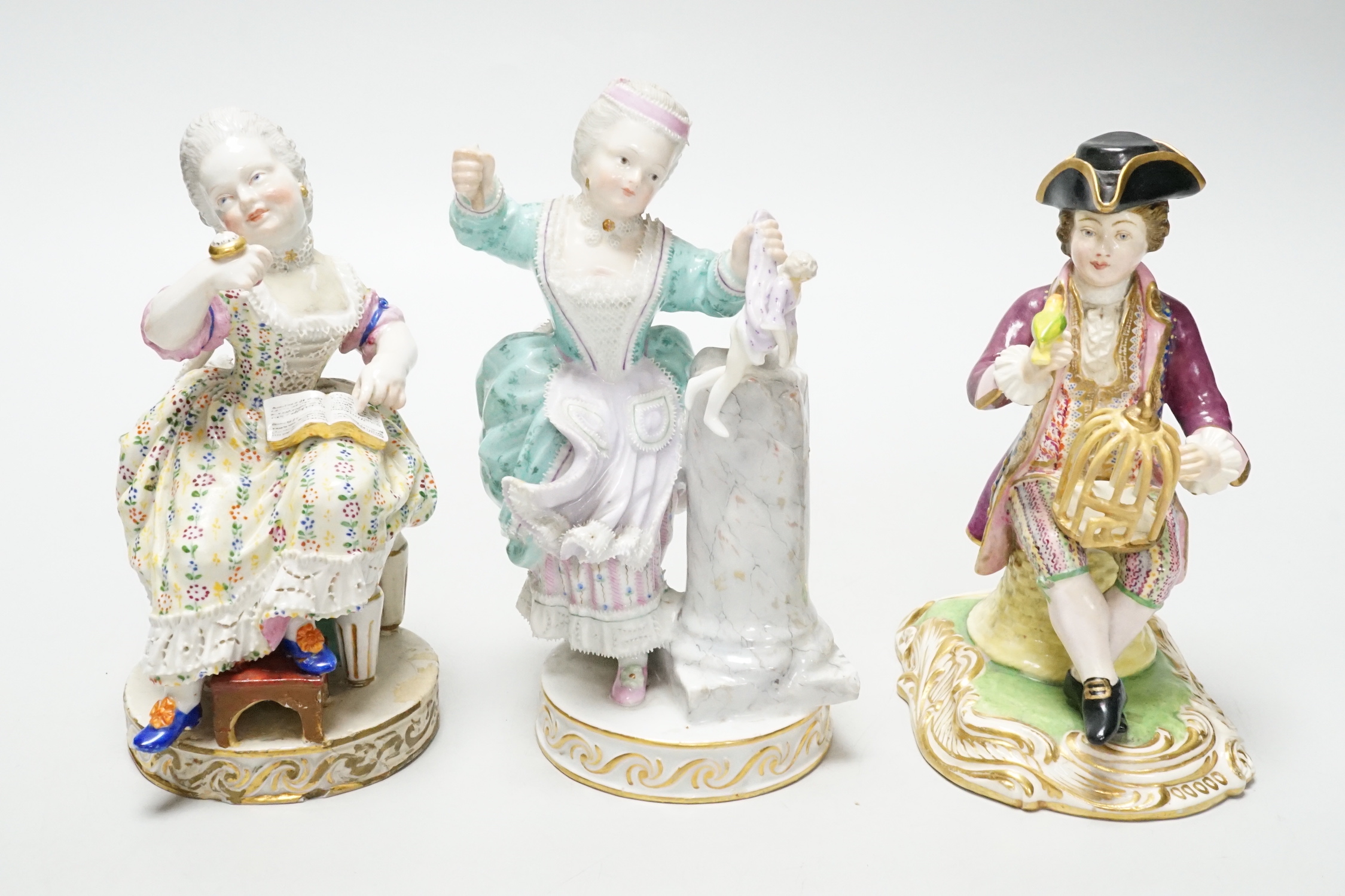 Three Meissen figure groups (with damage), tallest, figurine holding a doll, 15.5cm high